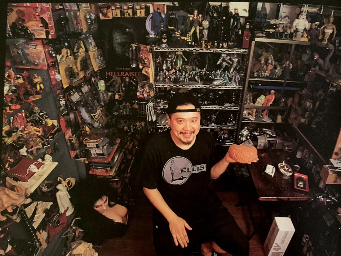 Nirasawa in one corner of his office, his extensive toy collection on display.